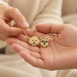 Golden personalised pet bracelet offered as a gift between two hands
